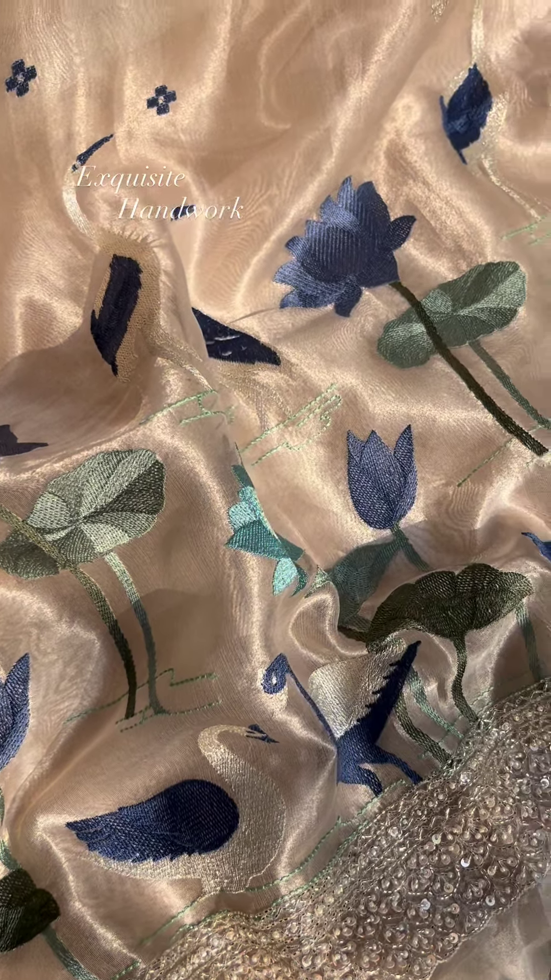 Close-Up of Exquisite Silk Fabric with Hand-Embroidered Lotus and Swan Motifs